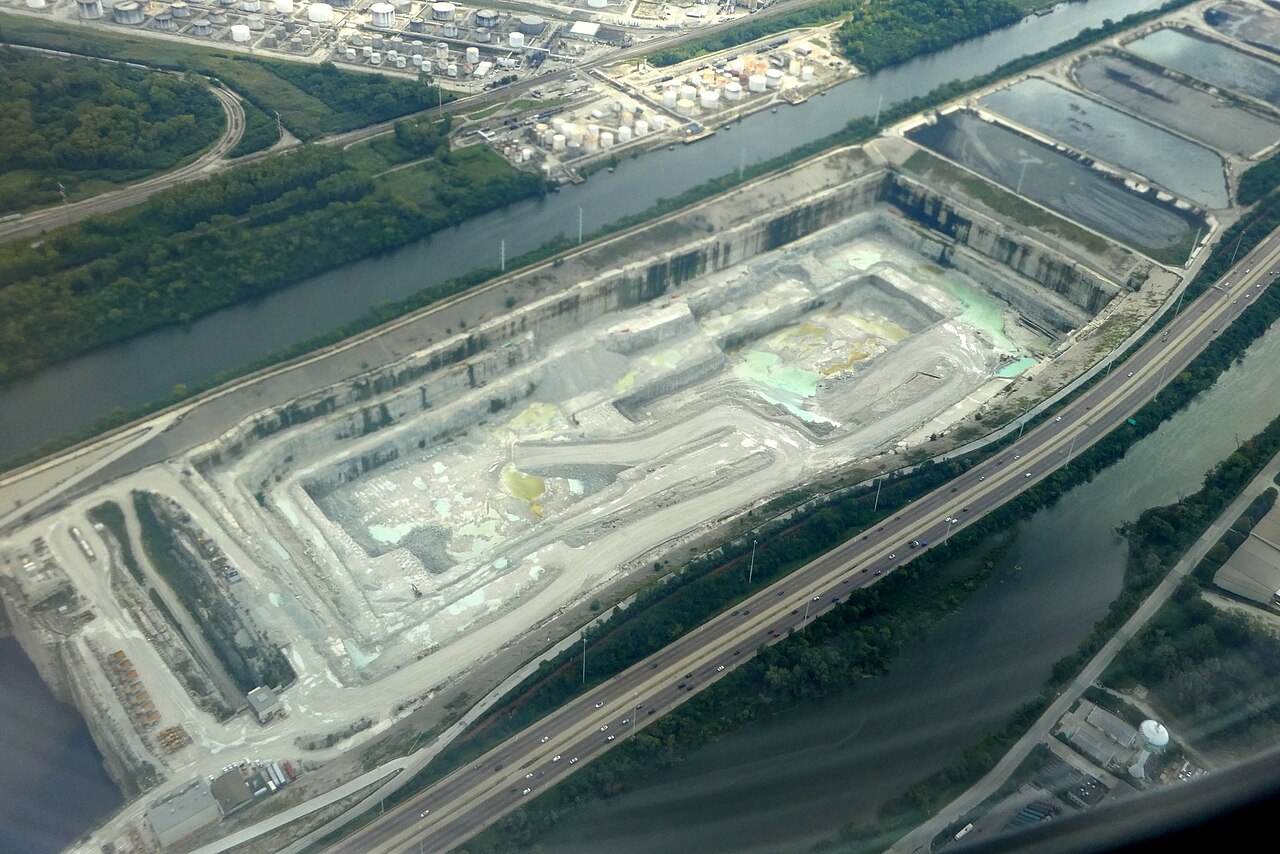Aerial view of the rock-walled excavation for McCook Reservoir Phase II in September 2023, between the Chicago Sanitary and Ship Canal and the Des Plaines River.